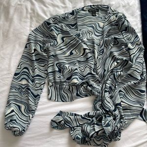 Size M in Womens. Blue wrap blouse!